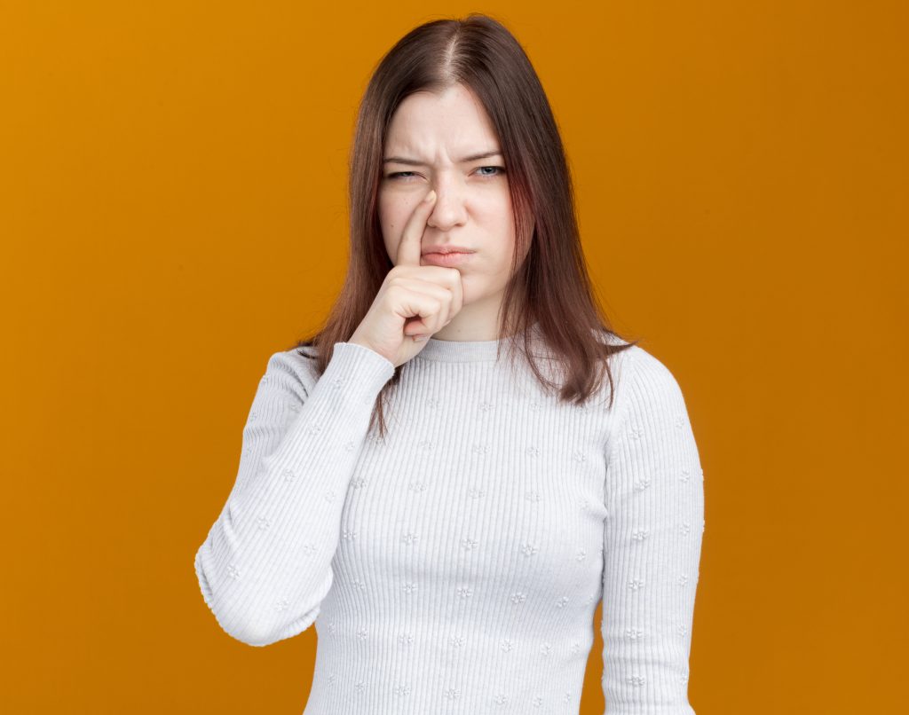 Close-up illustration of a painful pimple inside the nose showing redness, swelling, and irritation in the nasal passage.