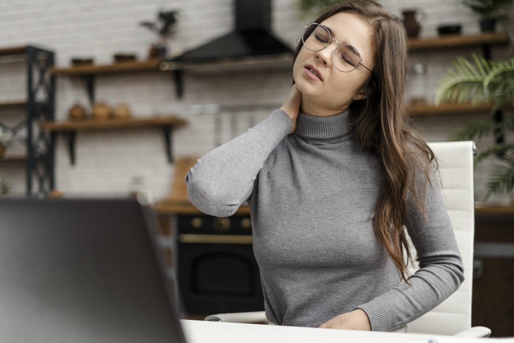 Person using natural methods such as stretching and heat therapy for fast neck pain relief.
