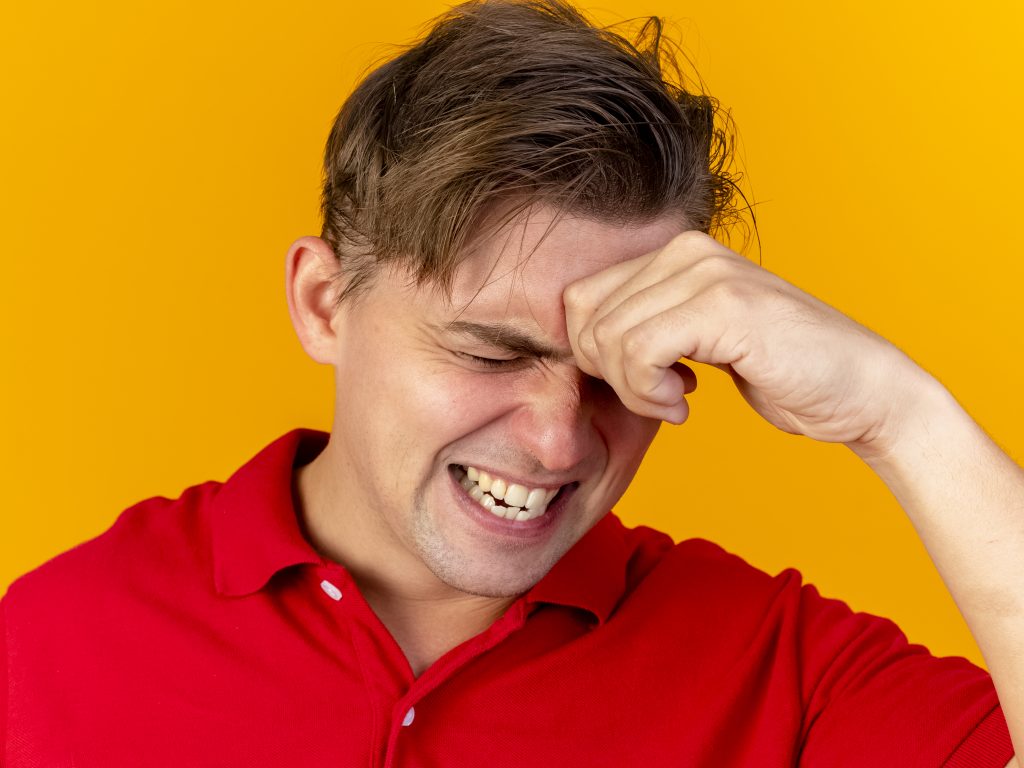 Person experiencing dry eyes and blurred vision due to vitamin D deficiency, highlighting common eye symptoms, causes, and effective treatment options.