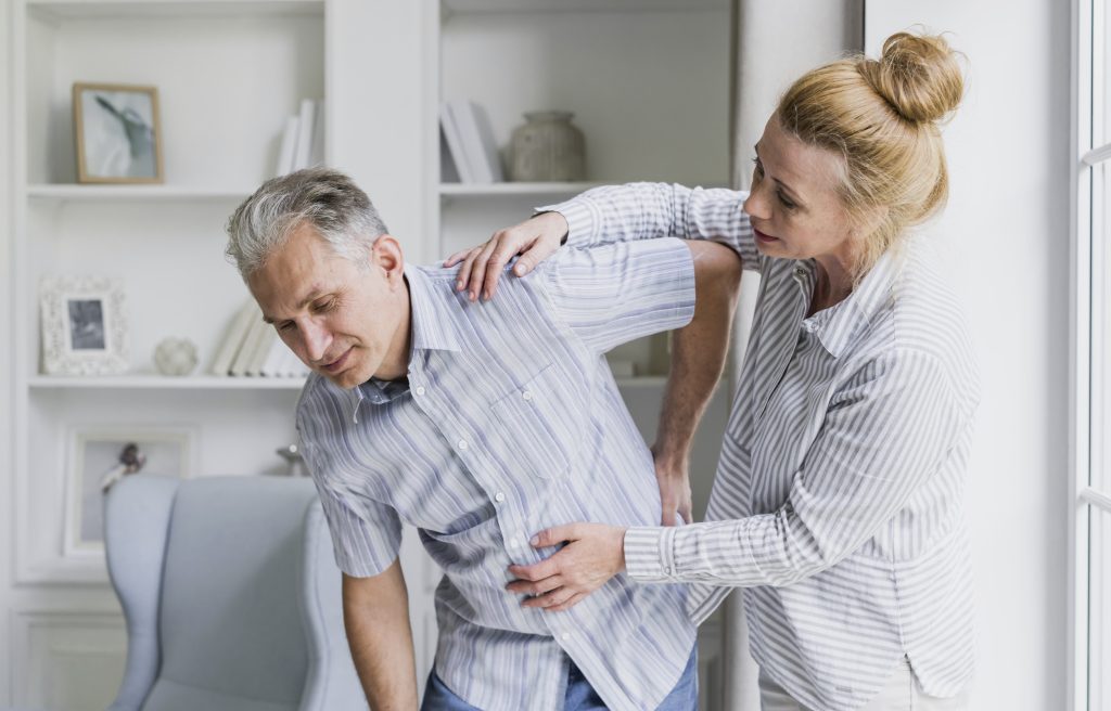 Lower Back Pain When Bending while picking up an object with lower back discomfort and poor posture