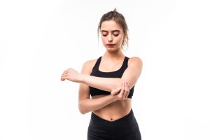 Pain in Elbow When Straightening Arm caused by tendon injury, arthritis, or muscle strain with effective treatment options